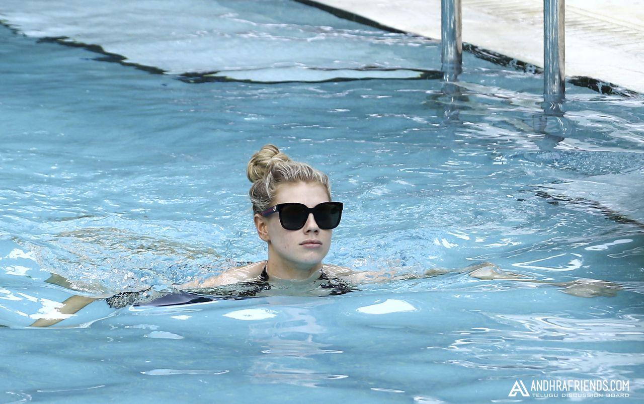 Charlotte McKinney Relaxes Poolside in Miami Photos